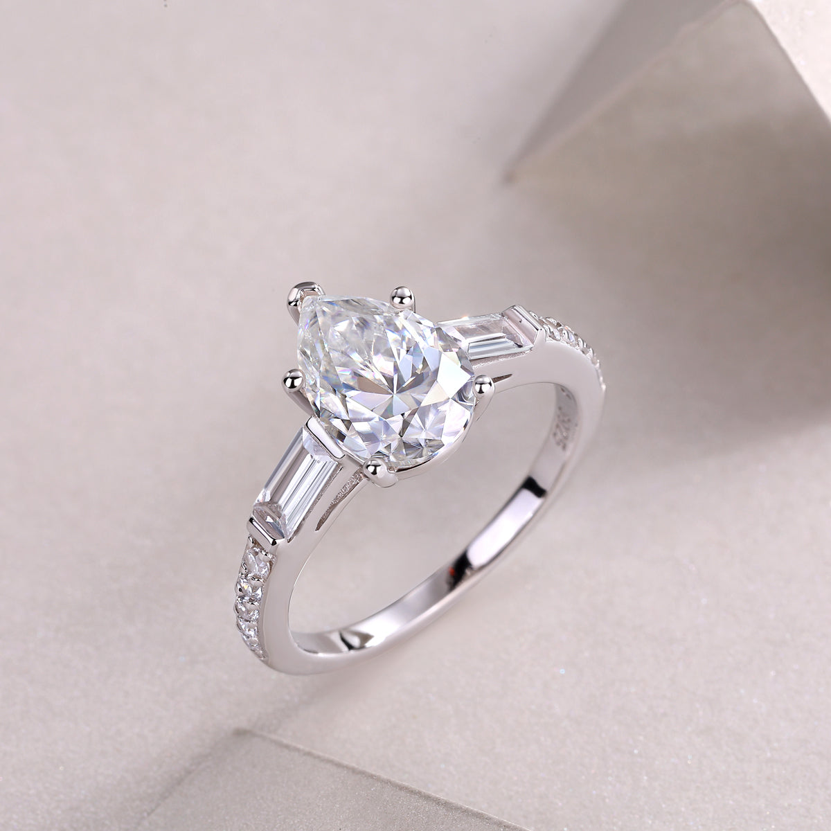 Pear Moissanite Ring with Baguette Side Stones in 925 Sterling Silver