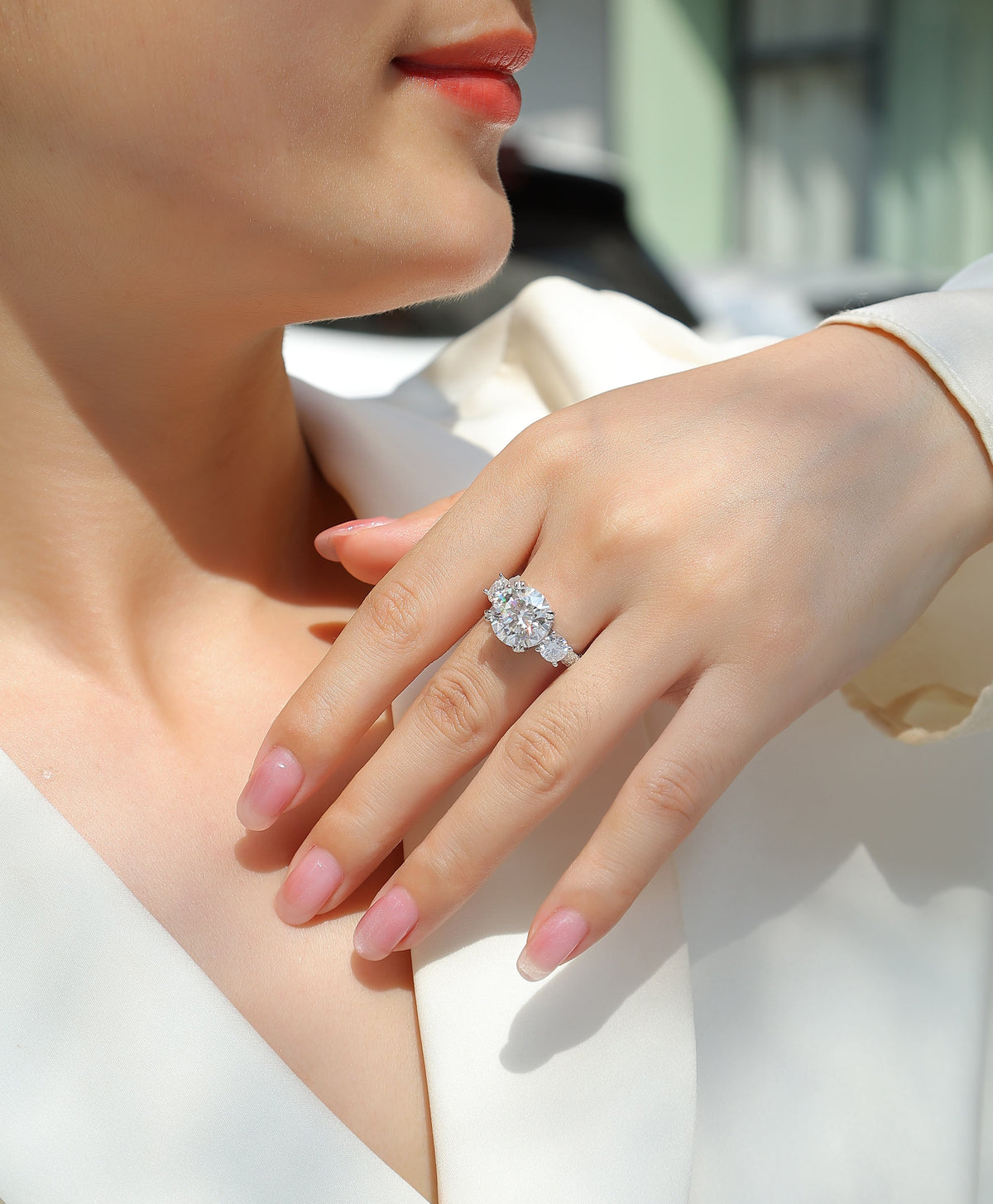 Round Moissanite Three-Stone Ring with Pave Band in 925 Sterling Silver - worn