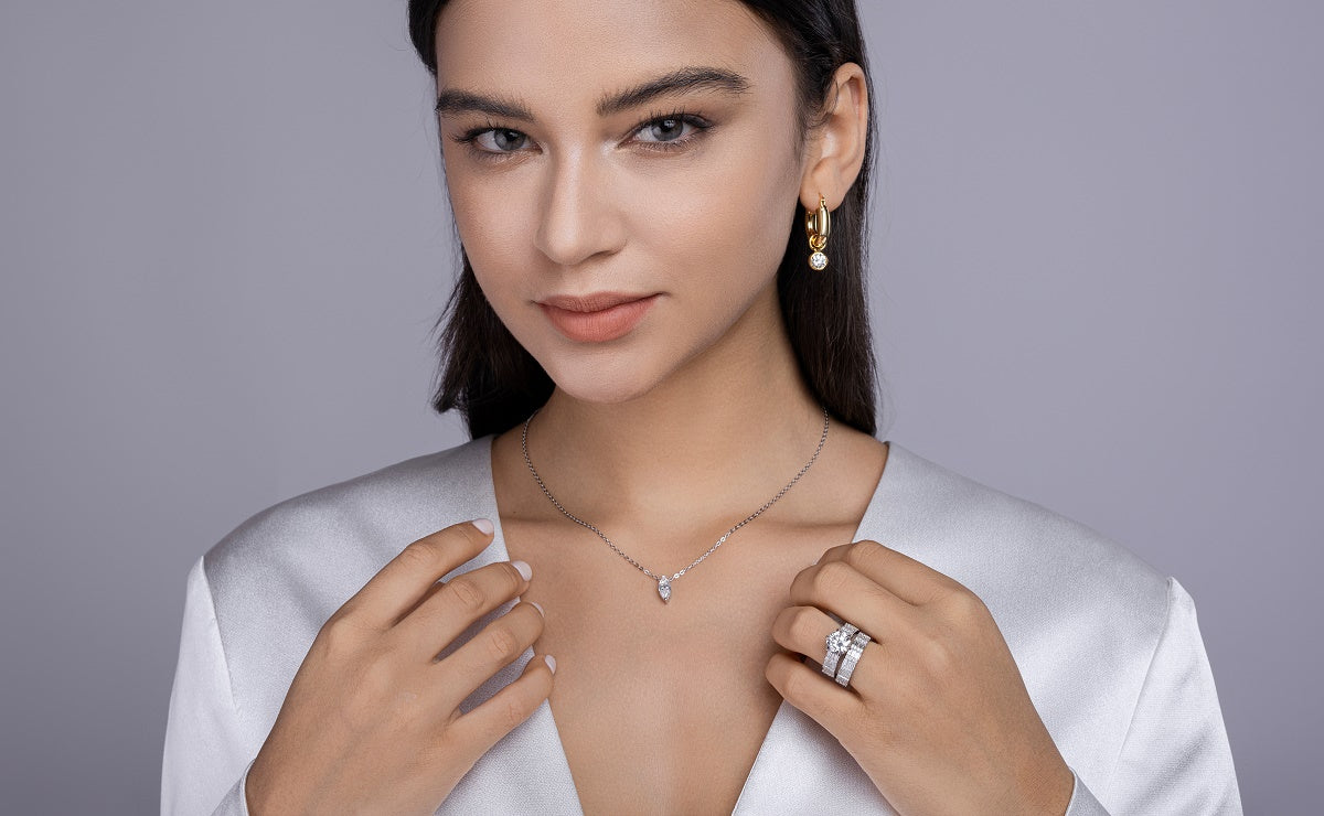 Round Moissanite Solitaire on Wide Baguette Band in 925 Silver - worn