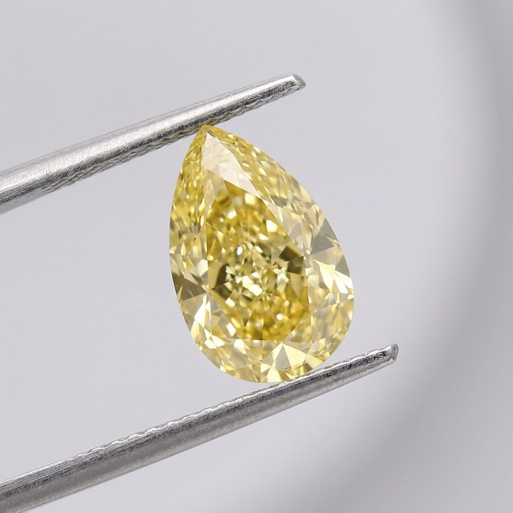 1.06 carat Fancy Intense Yellow pear lab-grown diamond, IGI LG737505659. AI-generated illustration of this stone; see the real photos and IGI report for its true colour.