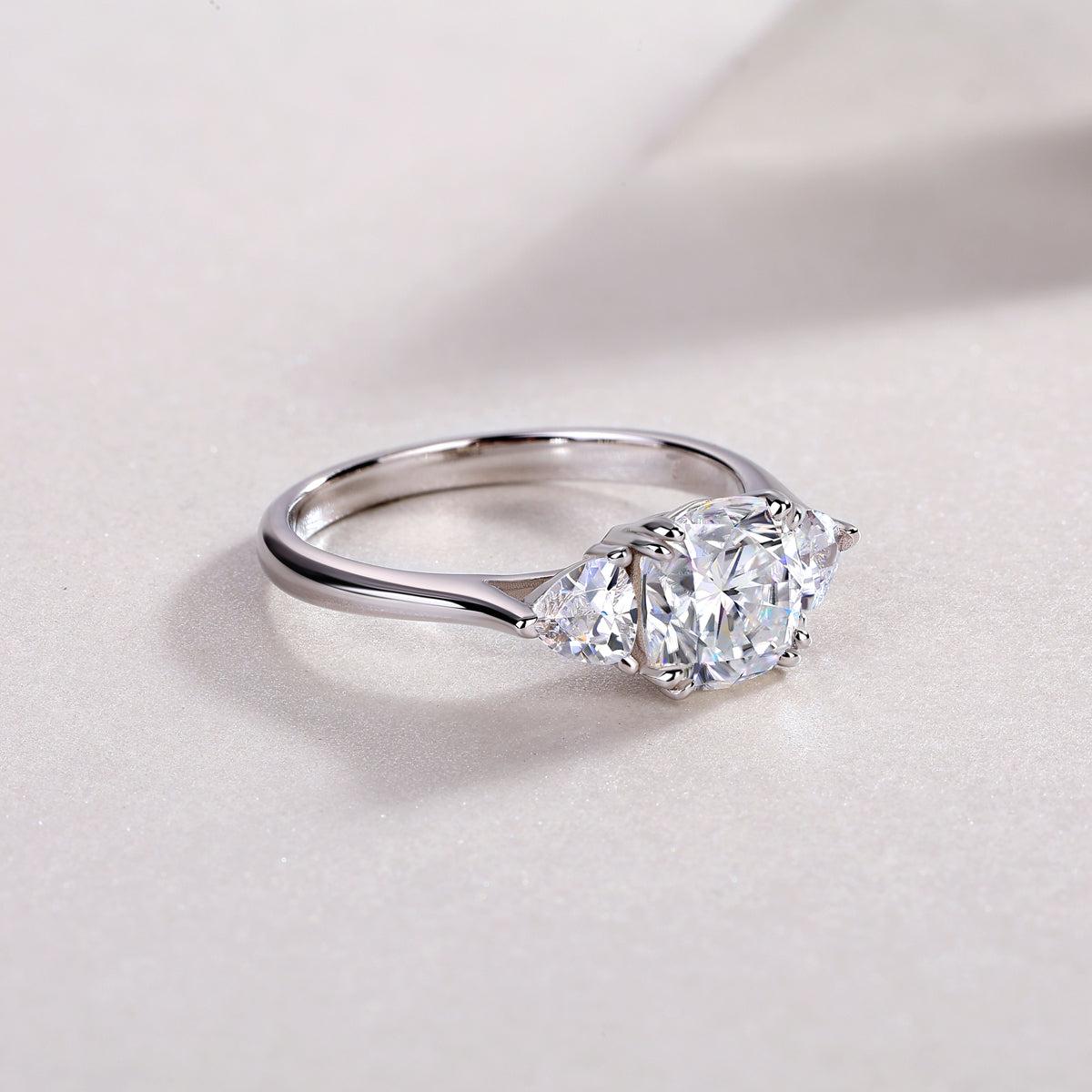 Cushion Moissanite Three-Stone Ring with Pear Sides in 925 Silver