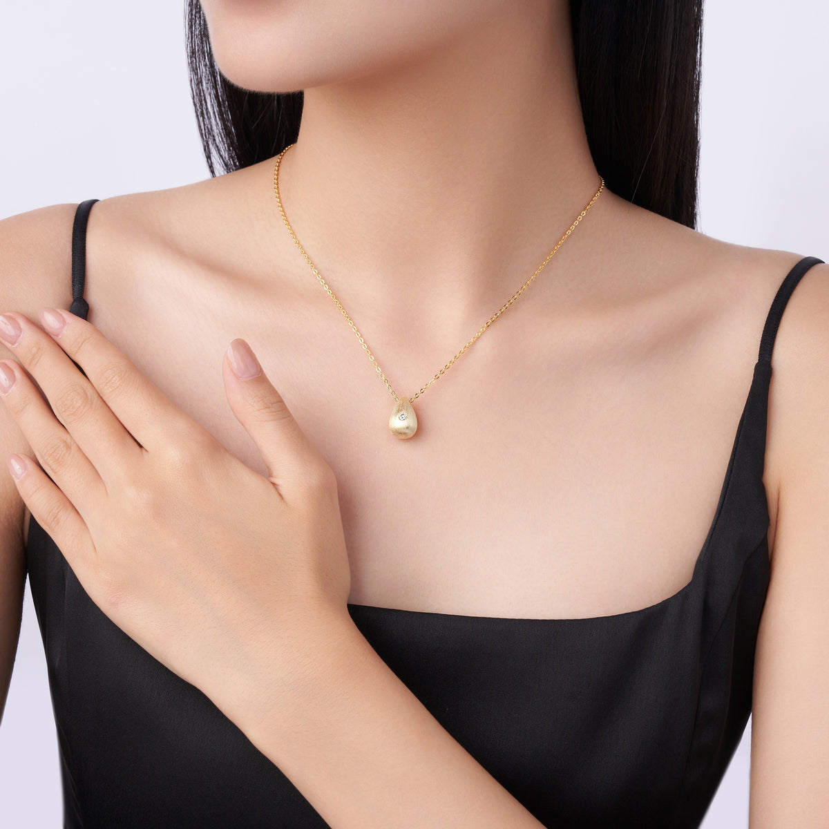 Moissanite Accent Polished Teardrop Pendant in Gold-Plated 925 Silver - worn