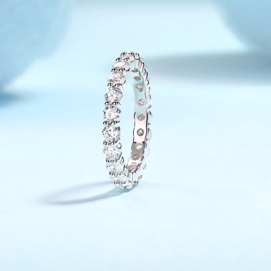 Round Moissanite Four-Prong Eternity Band in 925 Sterling Silver