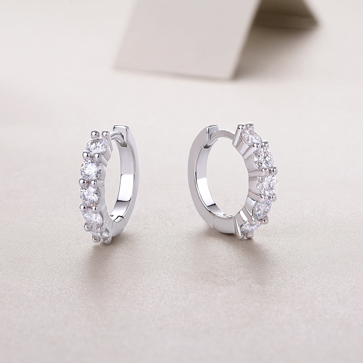 Round Moissanite Shared-Prong Huggie Hoop Earrings in 925 Silver