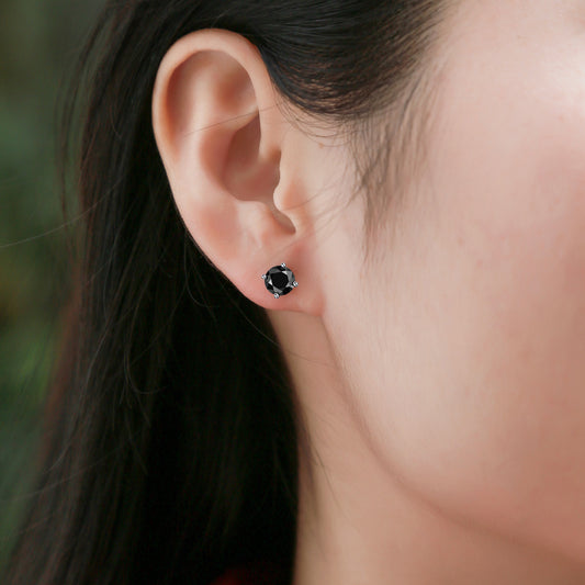 Black Moissanite Four-Prong Stud Earrings in 925 Sterling Silver - worn