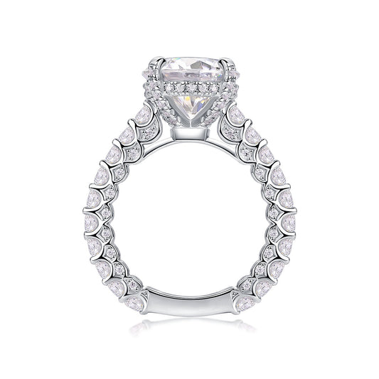Round Moissanite Four-Prong Solitaire with Pave Band in 925 Silver