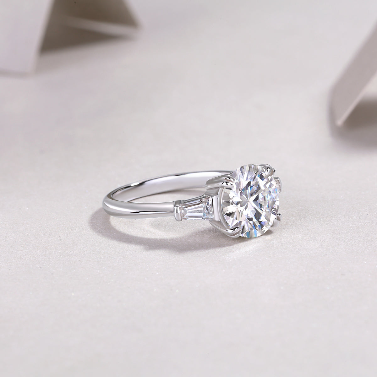 Round Moissanite Three-Stone Ring with Baguette Sides in 925 Silver