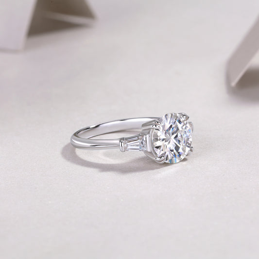 Round Moissanite Three-Stone Ring with Baguette Sides in 925 Silver