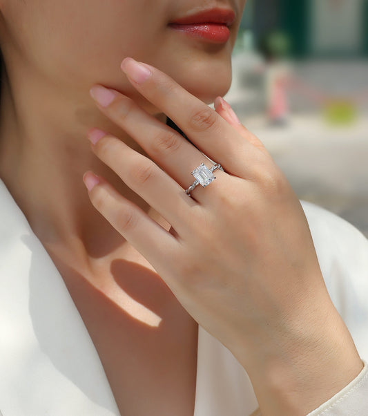 Emerald-Cut Moissanite Solitaire with Twisted Pave Band in 925 Silver - worn