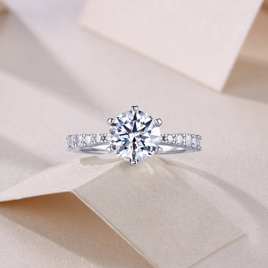 Round Moissanite Six-Prong Solitaire Ring with Pave Band in 925 Silver