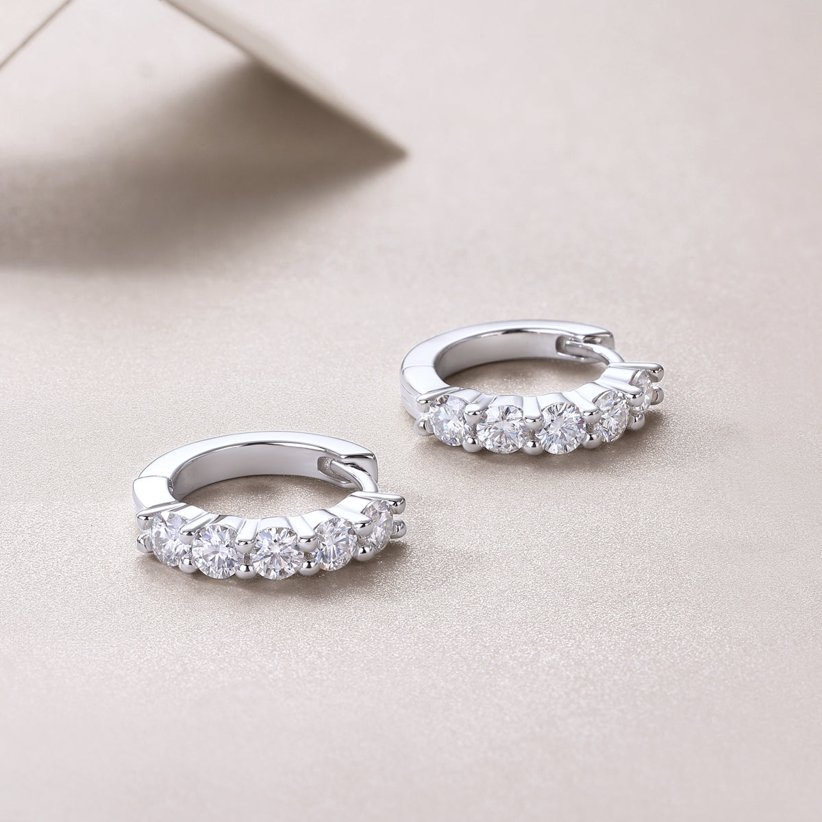 Round Moissanite Shared-Prong Huggie Hoop Earrings in 925 Silver