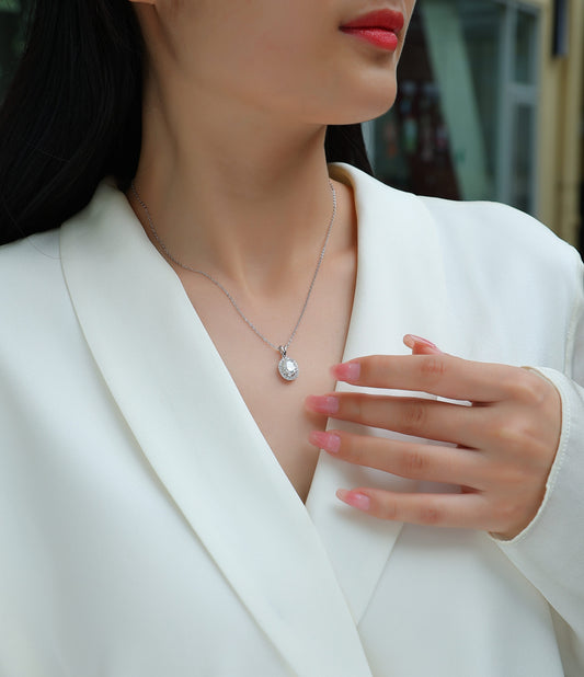 Oval Moissanite Halo Pendant Necklace in 925 Sterling Silver - worn
