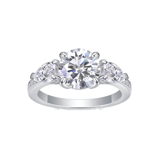Round Moissanite Ring with Pear Side Stones in 925 Sterling Silver