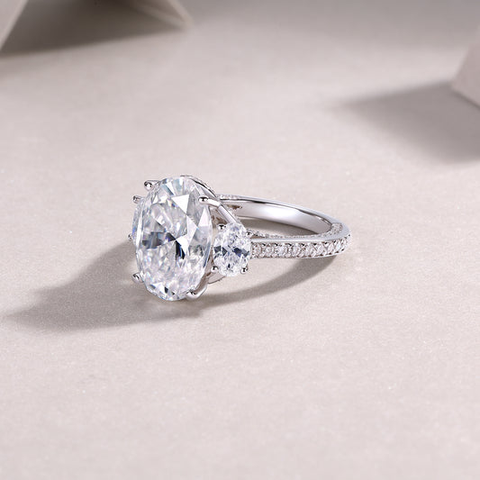 Oval Moissanite Three-Stone Ring with Half-Moon Sides in 925 Silver
