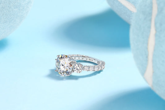 Round Moissanite Three-Stone Ring with Pave Band in 925 Silver