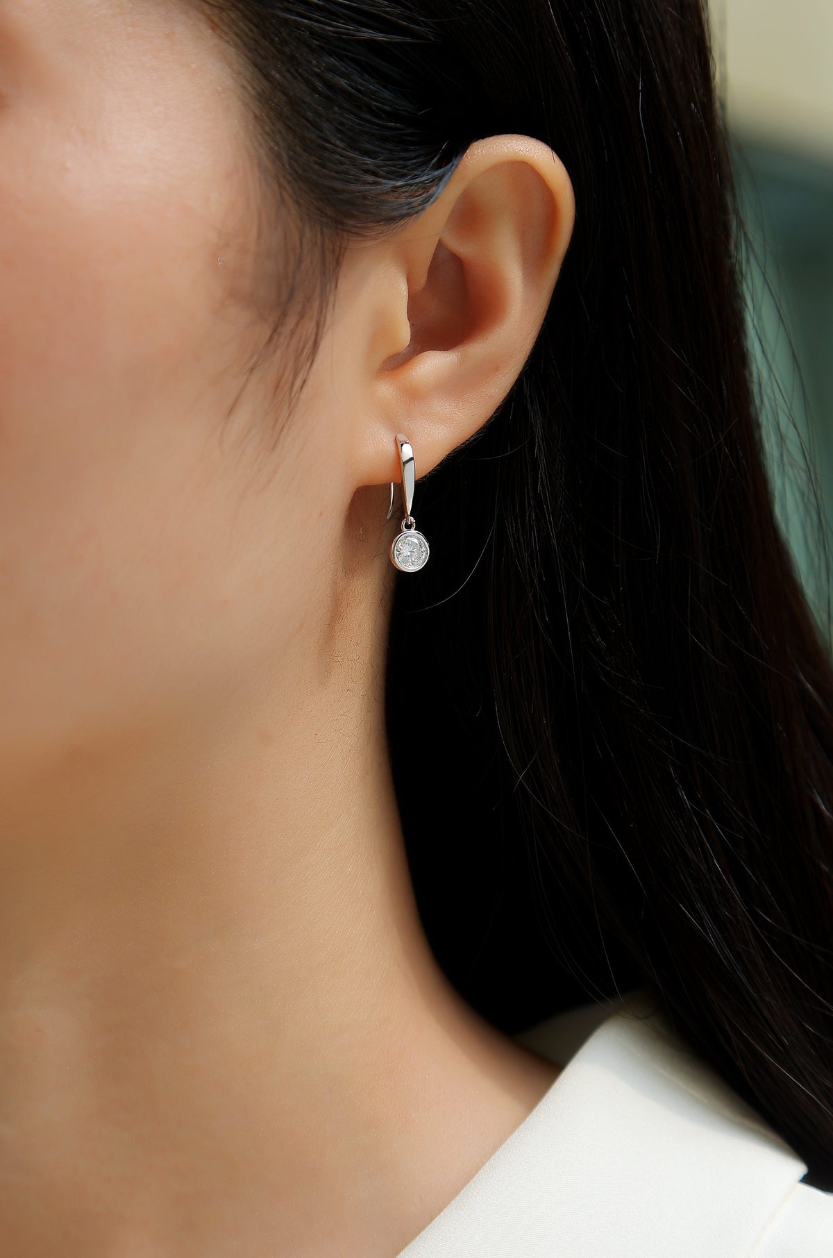 Round Moissanite Bezel Drop Earrings in 925 Sterling Silver - worn