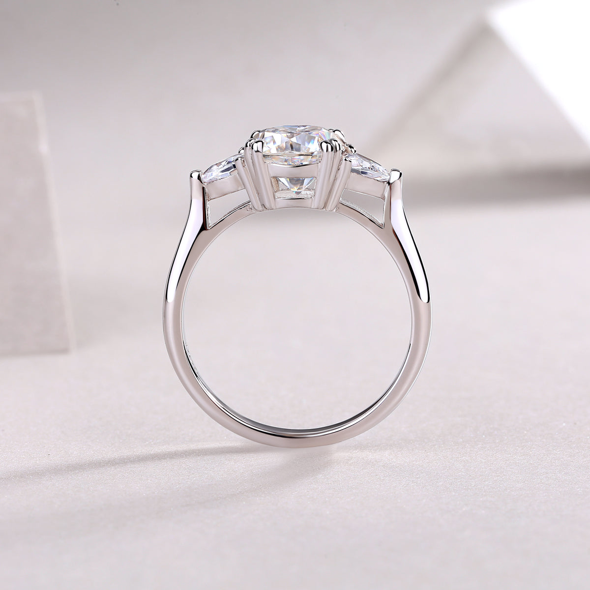 Cushion Moissanite Three-Stone Ring with Pear Sides in 925 Silver