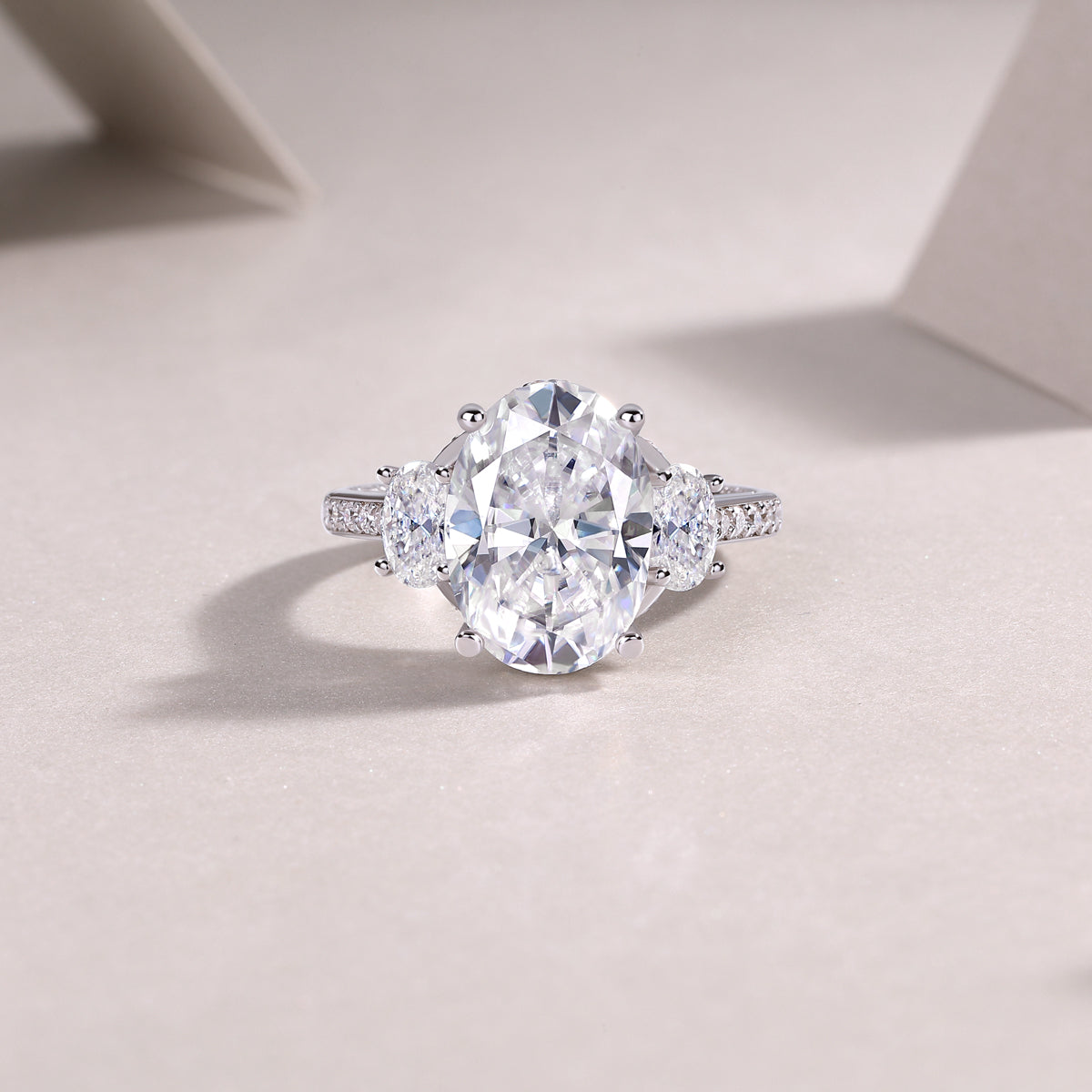 Oval Moissanite Three-Stone Ring with Half-Moon Sides in 925 Silver