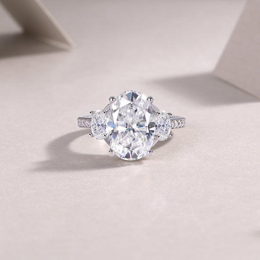Oval Moissanite Three-Stone Ring with Half-Moon Sides in 925 Silver