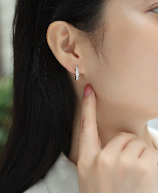 Round Moissanite Prong-Set Huggie Hoop Earrings in 925 Silver - worn