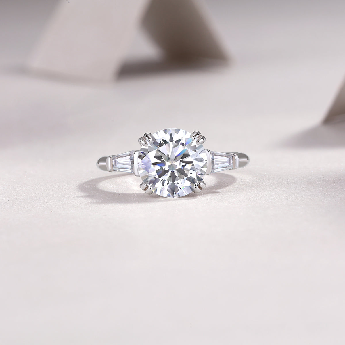 Round Moissanite Three-Stone Ring with Baguette Sides in 925 Silver