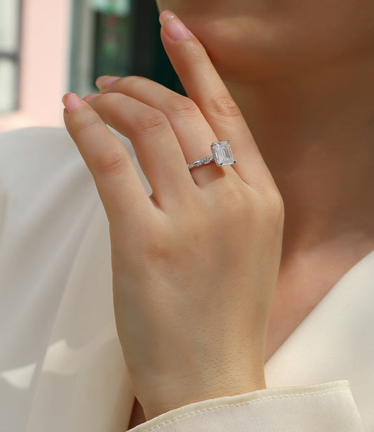 Emerald-Cut Moissanite Solitaire with Twisted Pave Band in 925 Silver - worn