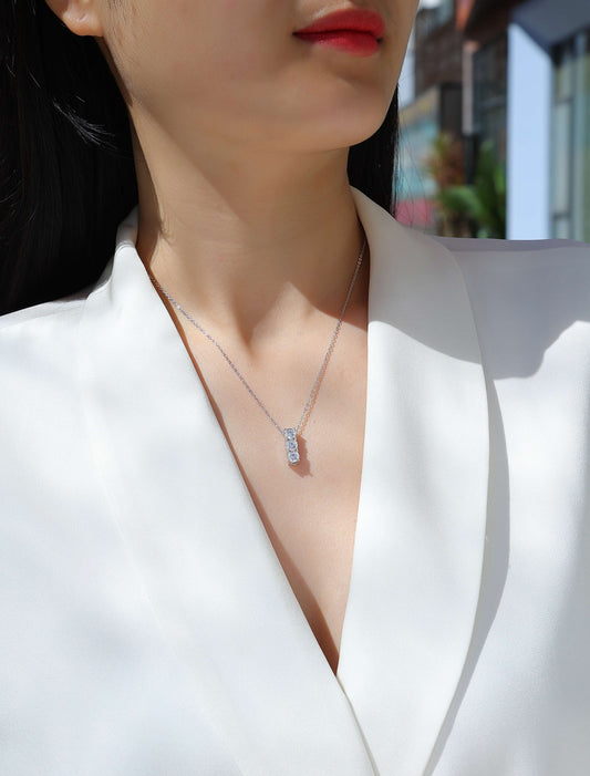 Three-Stone Round Moissanite Bar Pendant Necklace in 925 Sterling Silver - worn