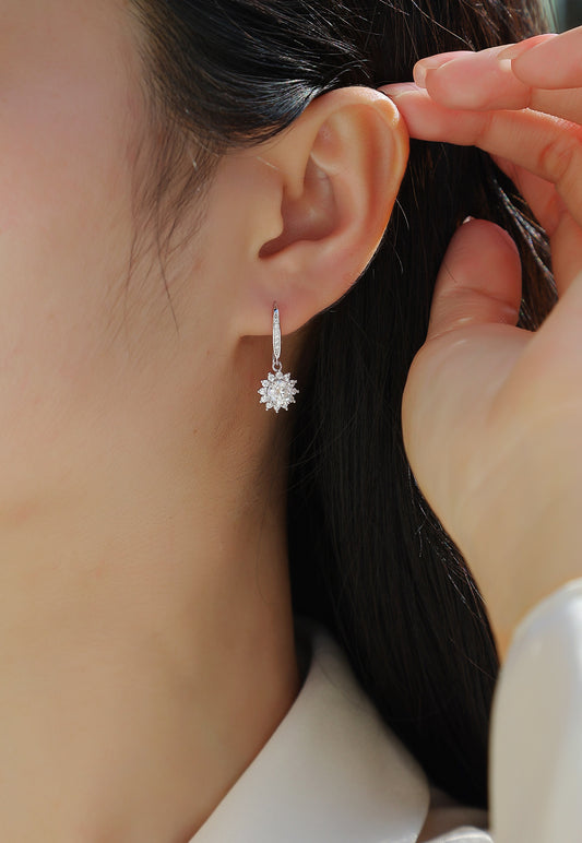 Round Moissanite Sunburst Halo Drop Earrings in 925 Sterling Silver - worn