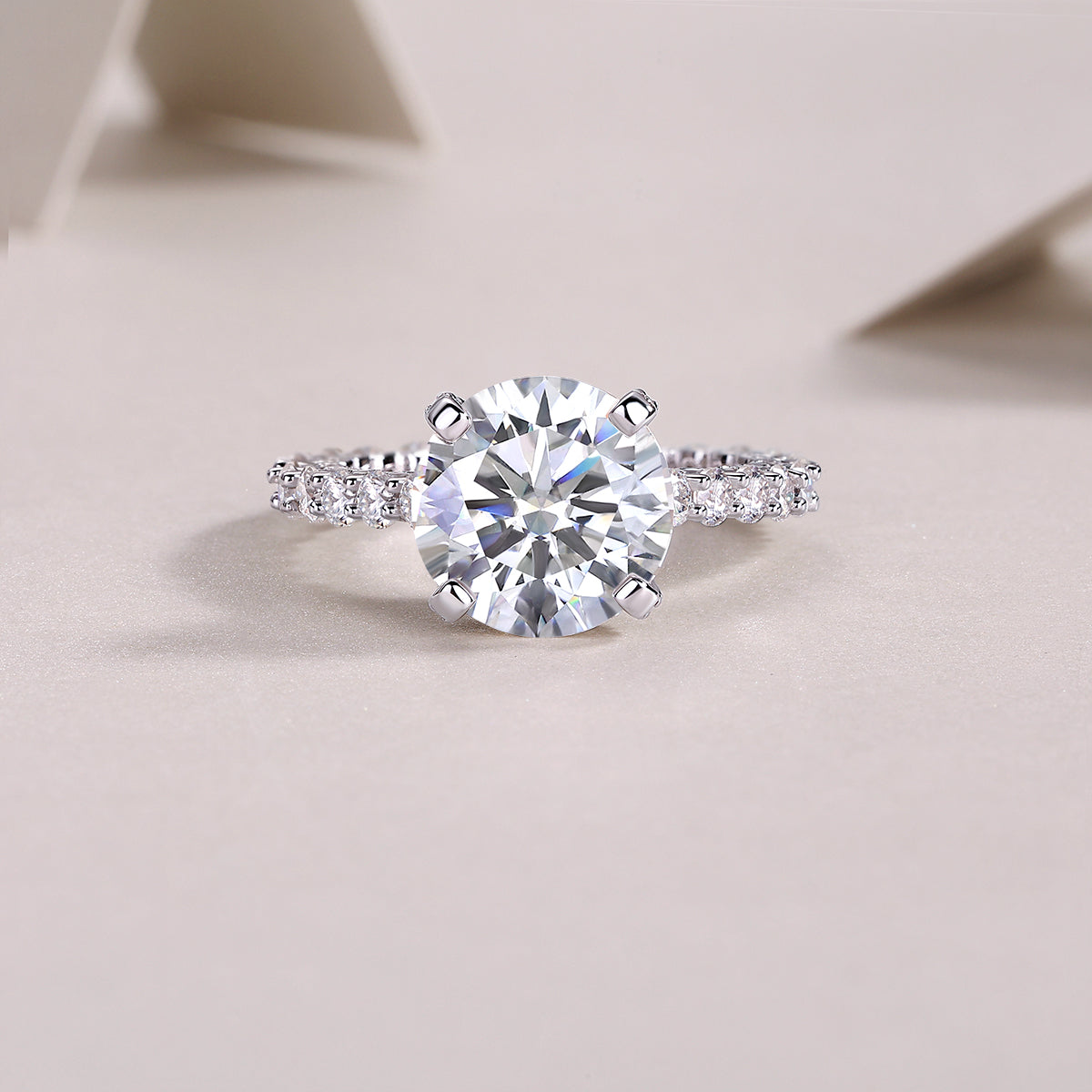 Round Moissanite Four-Prong Solitaire with Pave Band in 925 Silver