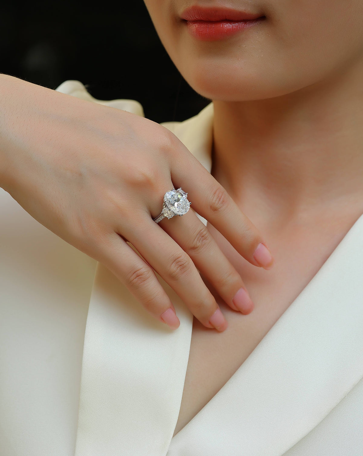 Oval Moissanite Three-Stone Ring with Half-Moon Sides in 925 Silver - worn