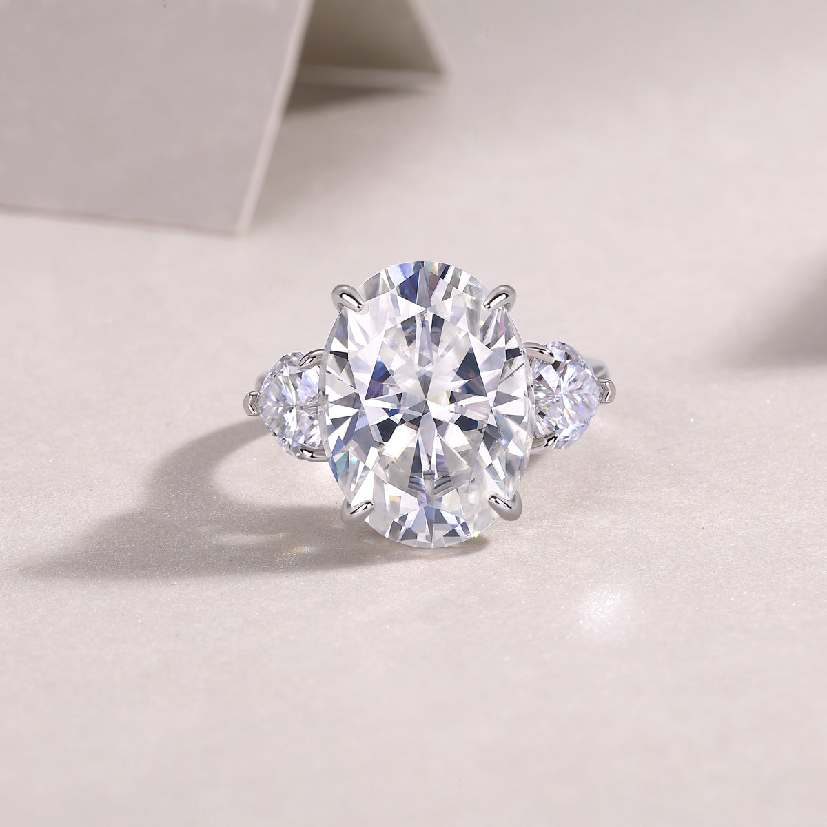Oval Moissanite Three-Stone Ring with Pear Sides in 925 Silver