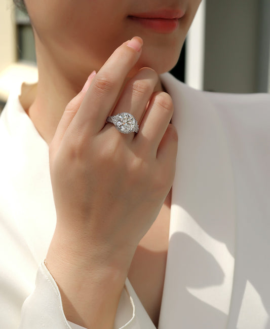 Round Moissanite Statement Ring with Side Stones and Pave Band in 925 Silver - worn