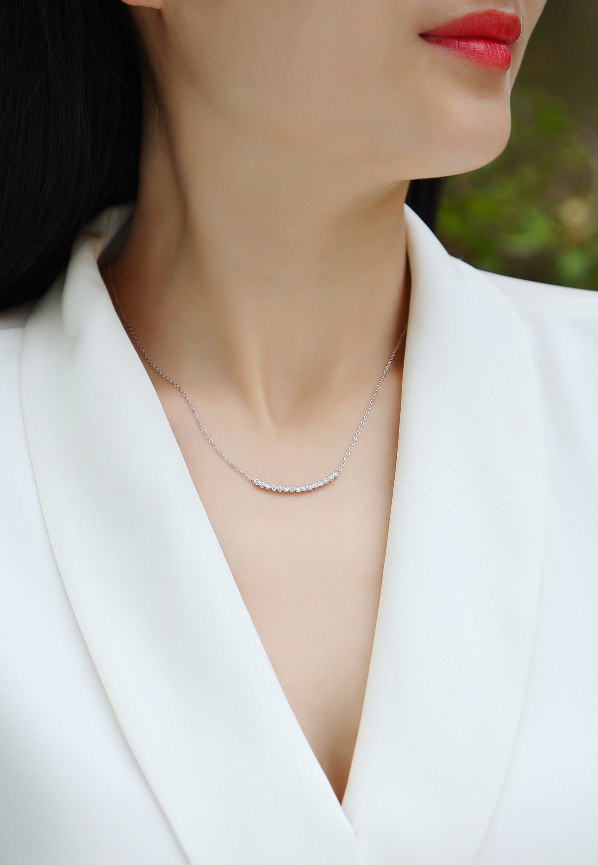 Bezel-Set Moissanite Curved Bar Necklace in 925 Sterling Silver - worn