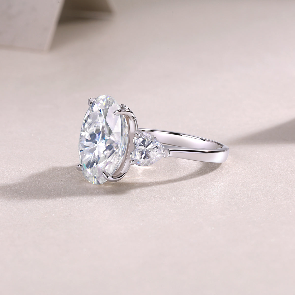 Oval Moissanite Three-Stone Ring with Pear Sides in 925 Silver