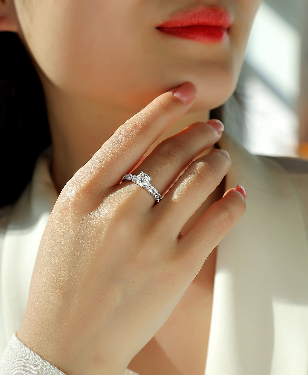 Round Moissanite Solitaire Ring with Shared-Prong Band in 925 Silver - worn