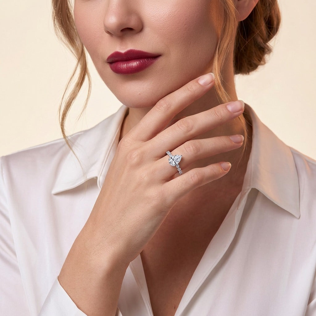 Pear Moissanite Solitaire with Marquise and Round Band in 925 Silver - on model