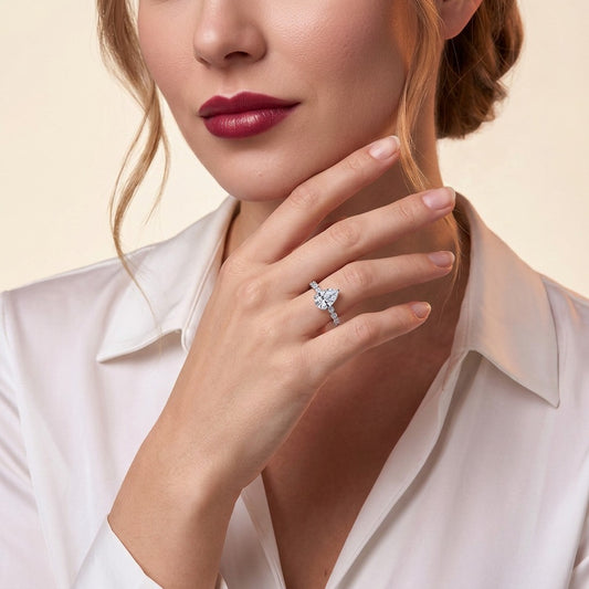 Pear Moissanite Solitaire with Marquise and Round Band in 925 Silver - on model