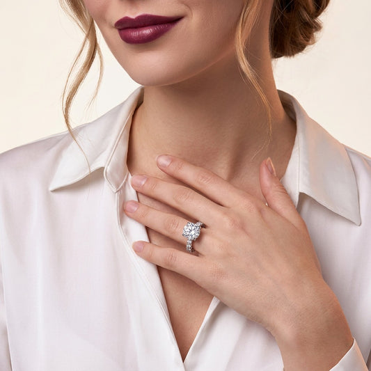 Round Moissanite Four-Prong Solitaire with Pave Band in 925 Silver - on model