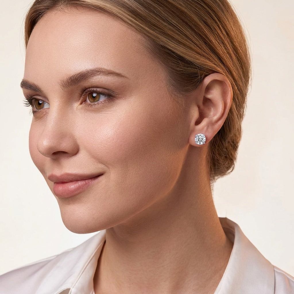 Round Moissanite Four-Prong Solitaire Stud Earrings in 925 Silver - on model