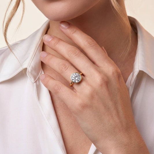 Round Moissanite Bezel Solitaire Ring in Gold-Plated 925 Silver - on model