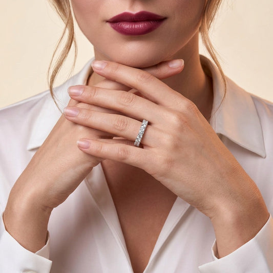 Round Moissanite Four-Prong Eternity Band in 925 Sterling Silver - on model