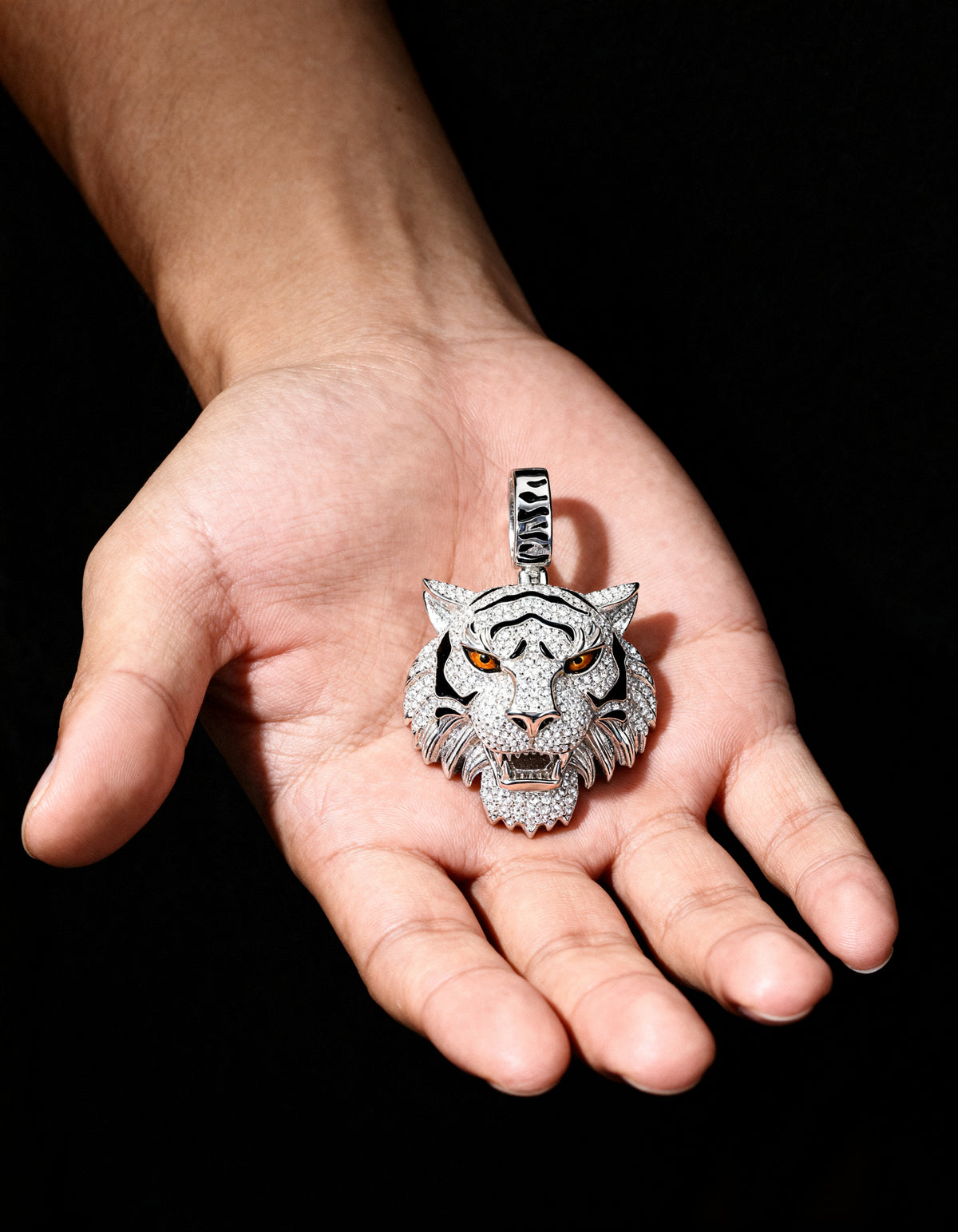 Moissanite Tiger Pendant in 925 silver - three-quarter view in the palm