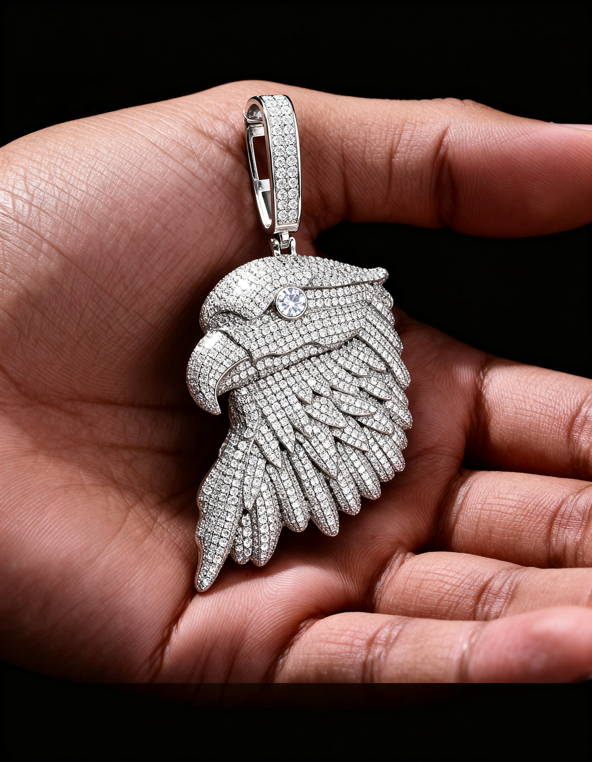 Iced Out Bald Eagle Pendant in 925 silver with moissanite - three-quarter view in the palm
