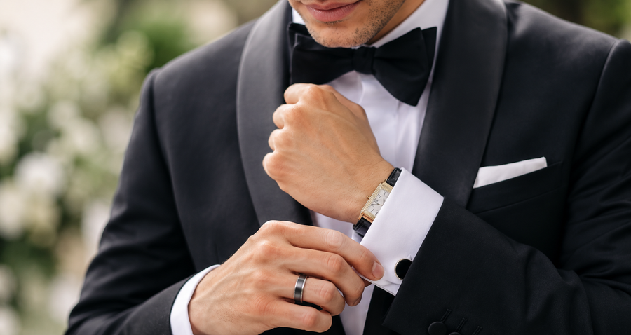 Groom wearing a black wedding band